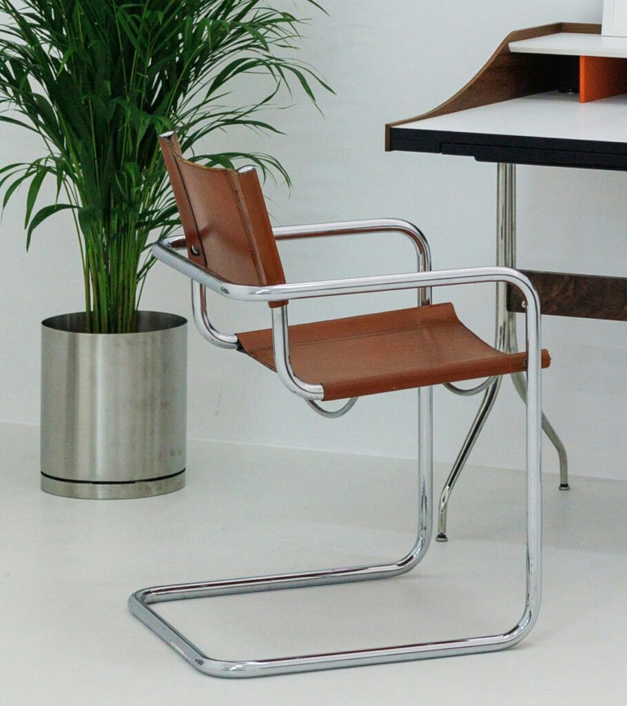 Brown leather and chrome cantilever chair, Bauhaus-inspired modern desk or dining chair in minimalist interior. (Accent Leather Chairs)